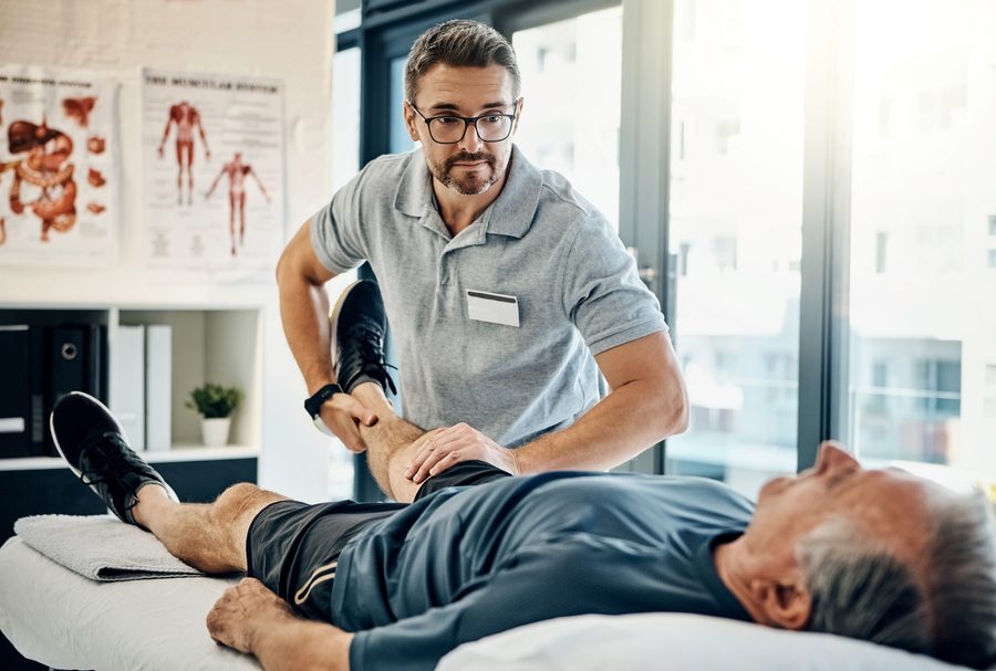 A patient receiving hands-on MSK care from a provider