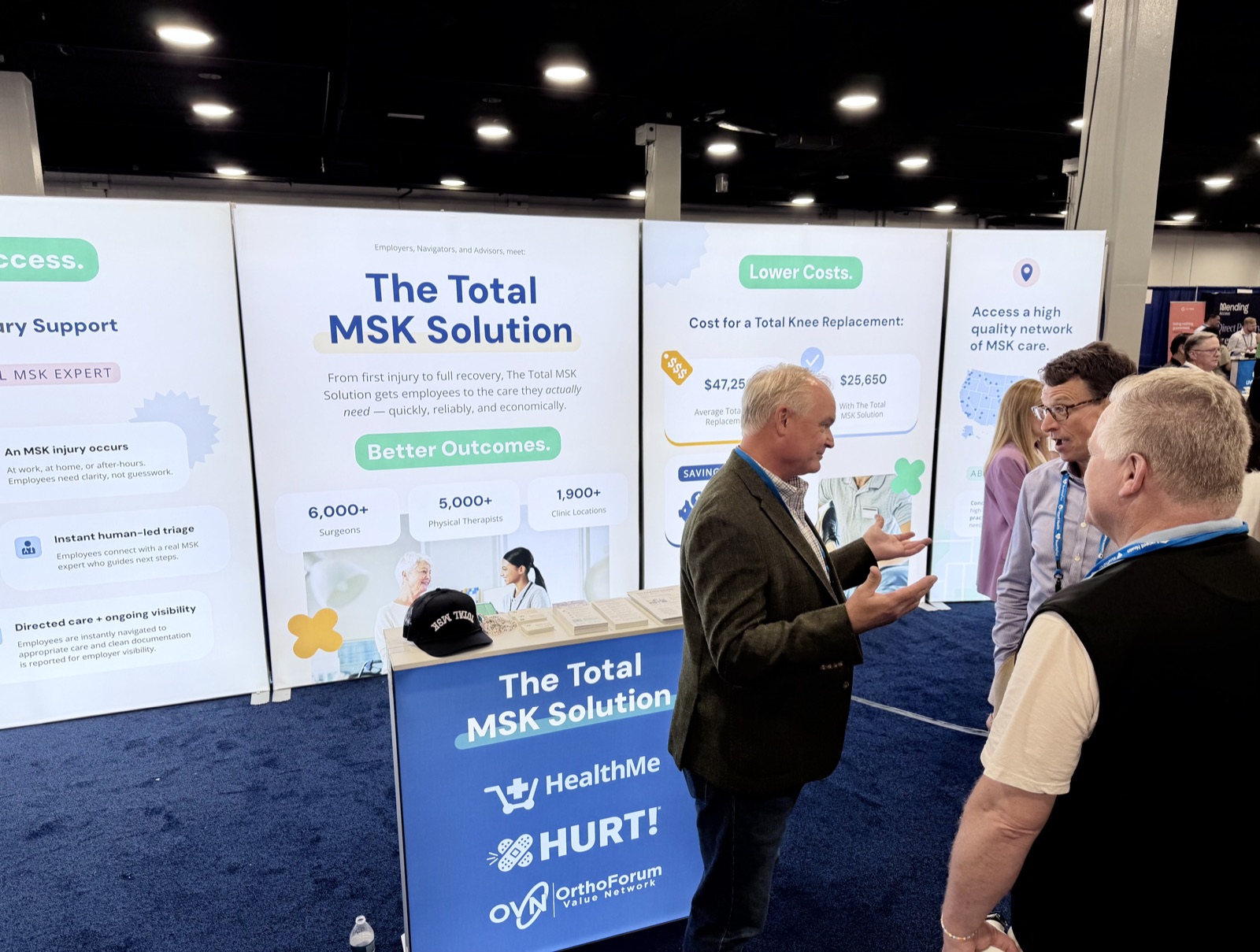 A HealthMe, HURT!, and OrthoForum Value Network team member talking with an employer about the Total MSK Solution